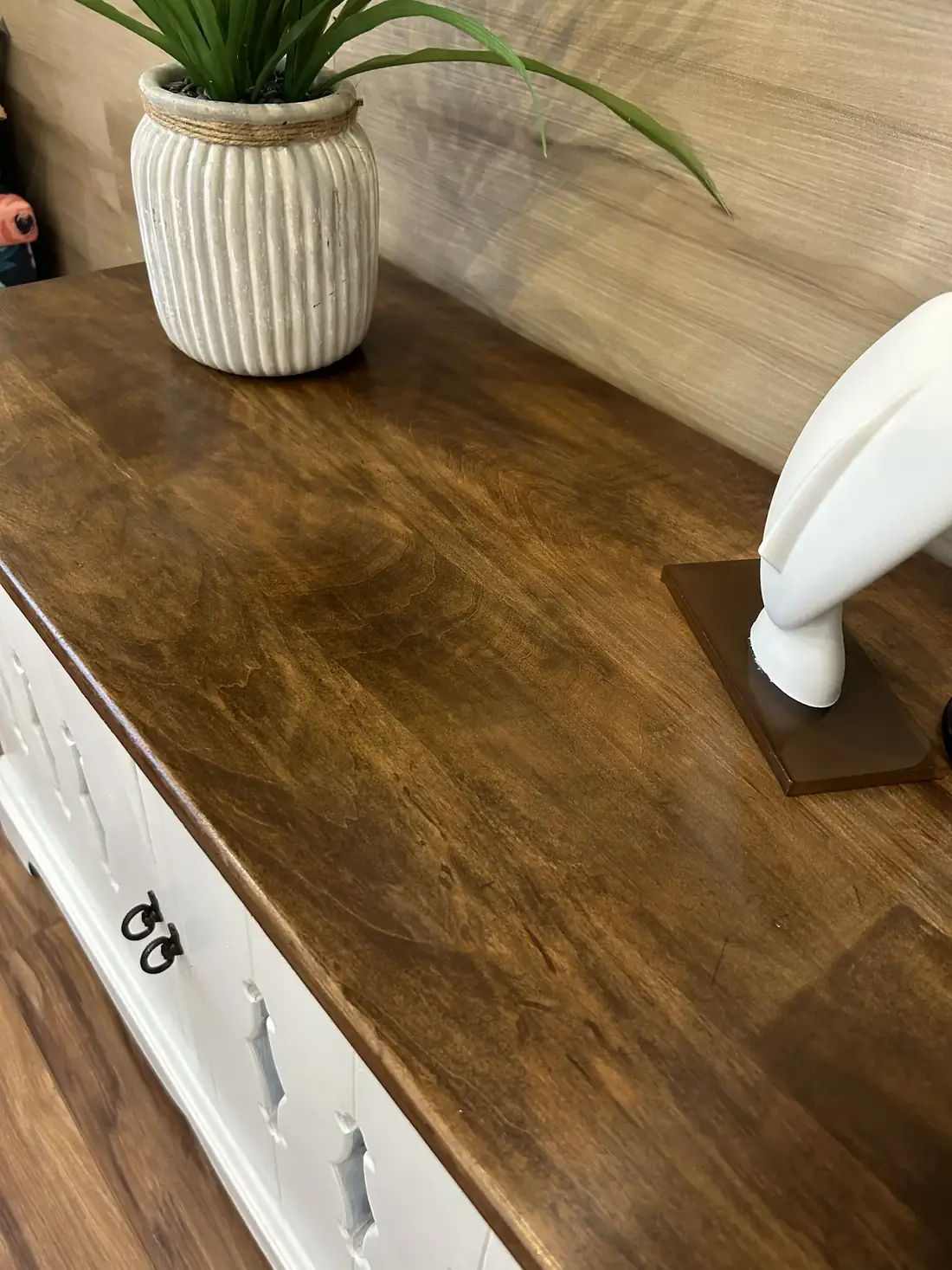 A close view of the cabinet’s new walnut top