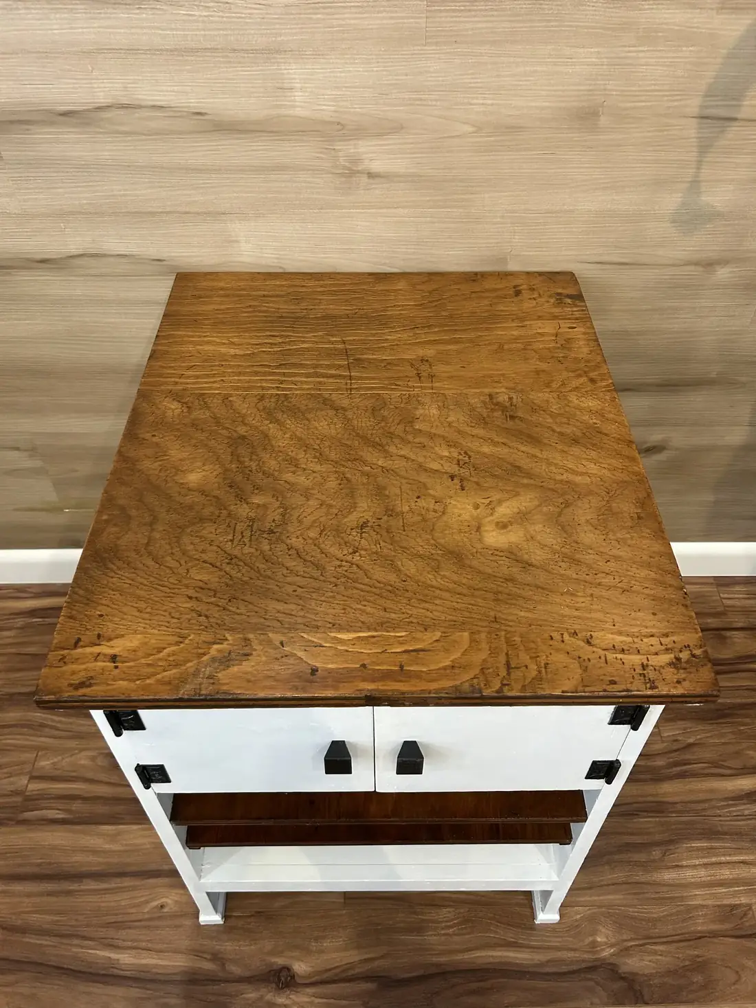A close view of the side cabinet’s stained top